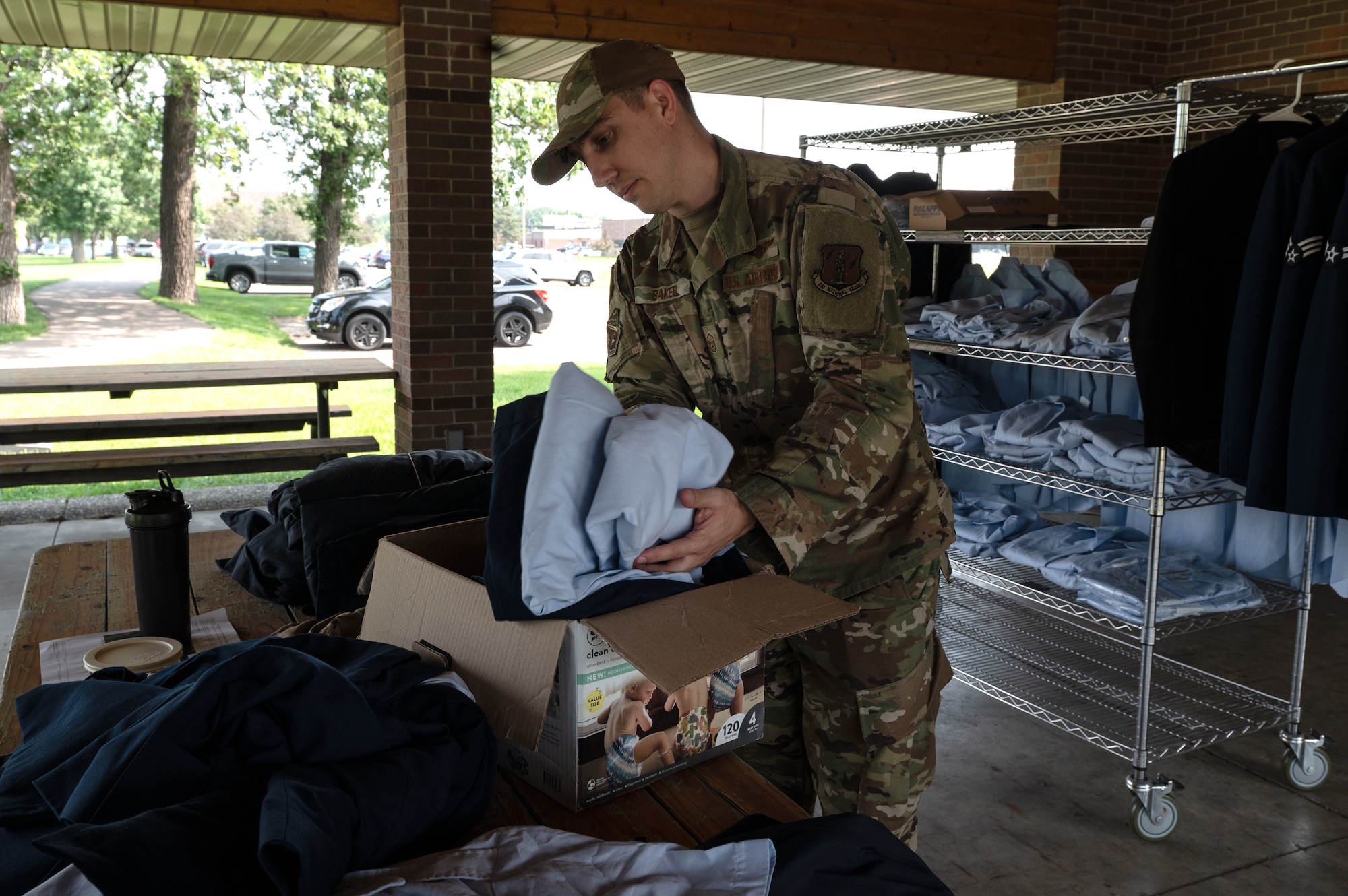 U.S. Air Force Master Sgt. Nicholas Baker, 133rd Medical Group, donates clothes at a blues swap in St. Paul, Minn., June 7, 2025.