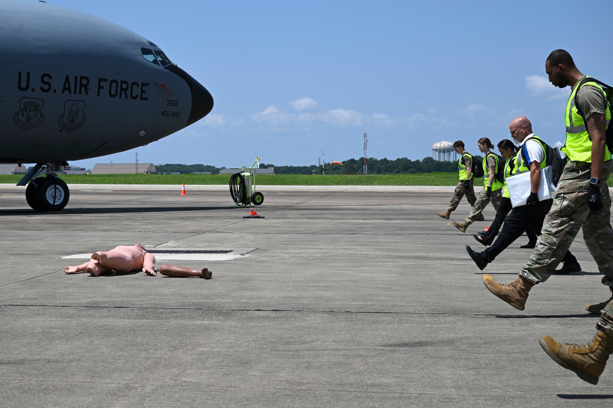 Members from the 316th Force Support Squadron conduct a search line sweep during a search and recovery exercise at Joint Base Andrews, Md., July 24, 2025. The base held the exercise to strengthen unit readiness and response capabilities in preparation for the upcoming airshow scheduled in September, ensuring personnel are equipped to respond in the event if an emergency.