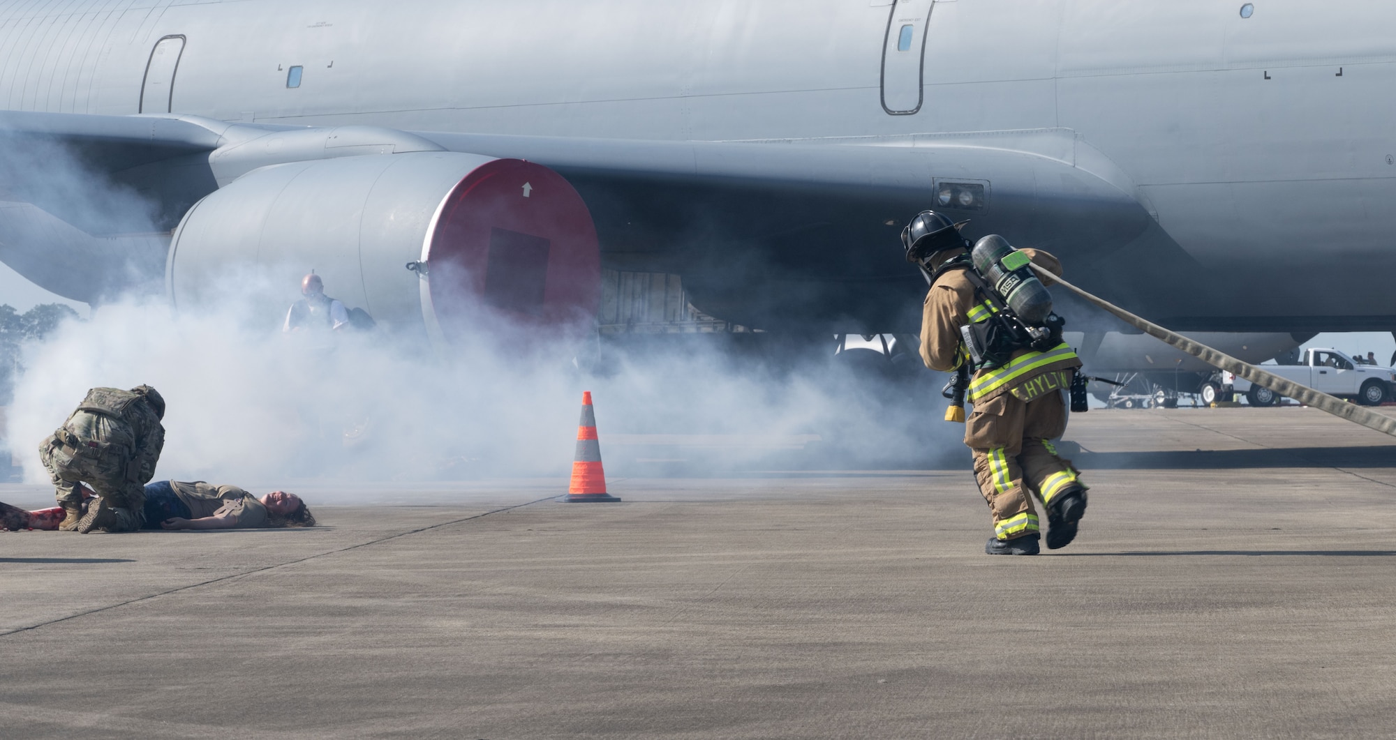 Franklin Hylton, a firefighter with the Joint Base Andrews Fire Department, prepares a hose to simulate extinguishing a fire during a field training exercise at Joint Base Andrews, Md., July 24, 2025. The exercise enhanced emergency response readiness ahead of the base’s September airshow.