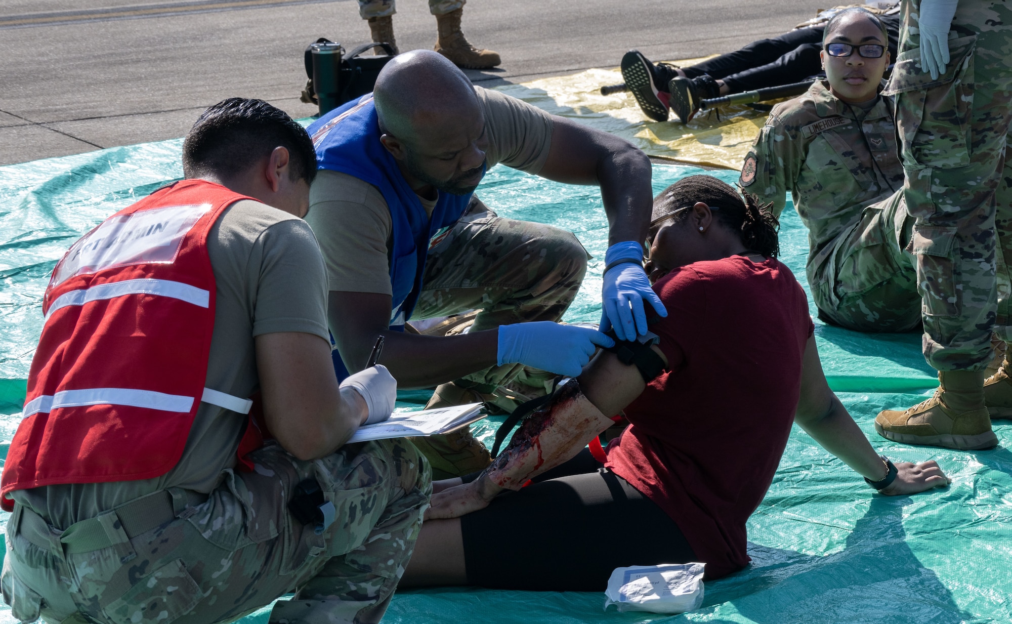 U.S. Air Force personnel with the Andrews Medical Group field response team simulate treating and documenting patient injuries during a field training exercise at Joint Base Andrews, Md., July 24, 2025. The exercise improved the team’s ability to deliver care and maintain records during emergency scenarios.