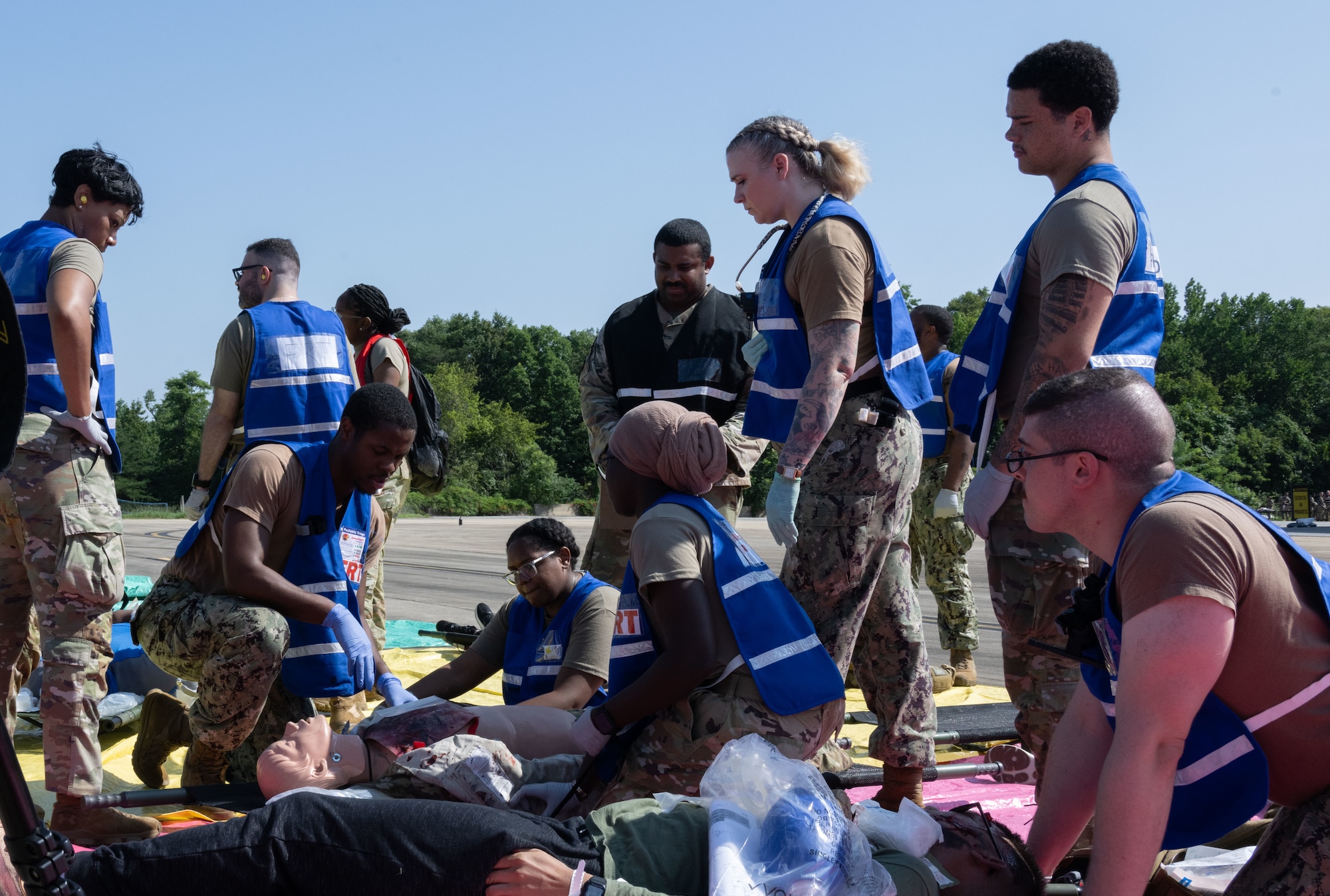 U.S. Air Force personnel with the Andrews Medical Group field response team assess simulated casualties during a field training exercise at Joint Base Andrews, Md., July 24, 2025. The scenario tested the team’s ability to triage multiple patients under pressure.
