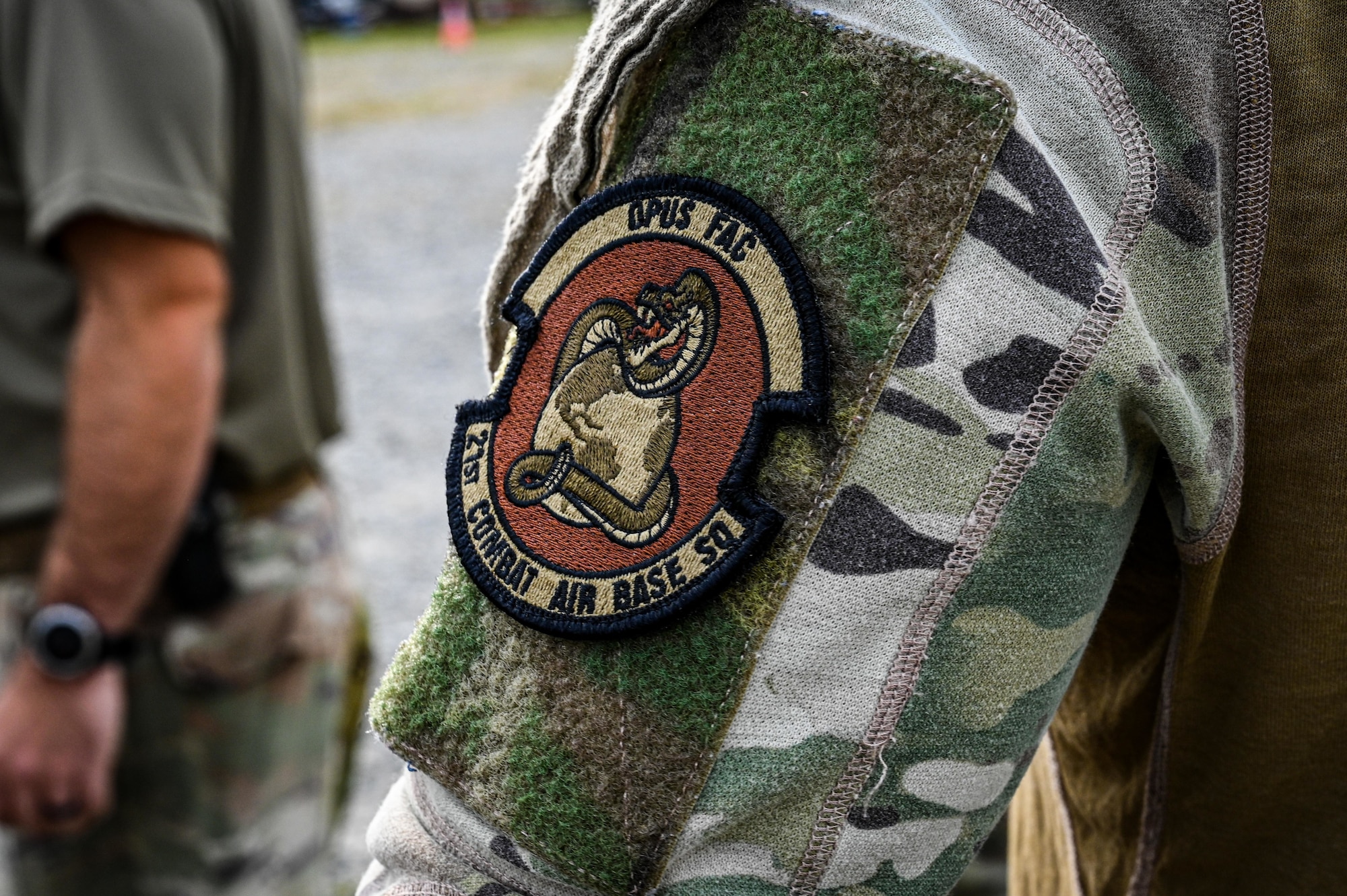 A patch is displayed on an airman's sleeve