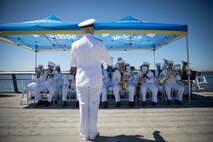 SEATTLE (July 29, 2025) – Navy Region Northwest Band performs on Pier 62 in Seattle prior to the parade of ships kicking off Seattle Fleet Week 2025. Seattle Fleet Week is a time-honored celebration of the sea services and provides an opportunity for the citizens of Washington to meet Sailors, Marines and Coast Guardsmen, as well as witness firsthand the latest capabilities. of today’s maritime services. (U.S. Navy photo by Mass Communication Specialist 1st Class Shane Bryan/Released)