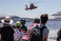 SEATTLE (July 29, 2025) Seattle residents observe an MH-60 Dolphin from the U.S. Coast Guard as it performs a search and rescue demonstration at Seattle Fleet Week 2025. Seattle Fleet Week is a time-honored celebration of the sea services and provides an opportunity for the citizens of Washington to meet Sailors, Marines and Coast Guardsmen, as well as witness firsthand the latest capabilities of today’s maritime services. (U.S. Navy photo by Mass Communication Specialist 1st Class Shane Bryan/Released)