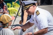 SEATTLE (July 29, 2025) – Capt. Jason Sherman, commander, Navy Region Northwest, speaks with a visitor during Seattle Fleet Week 2025. Seattle Fleet Week is a time-honored celebration of the sea services and provides an opportunity for the citizens of Washington to meet Sailors, Marines and Coast Guardsmen, as well as witness firsthand the latest capabilities of today’s maritime services. (U.S. Navy photo by Mass Communication Specialist 1st Class Shane Bryan/Released)