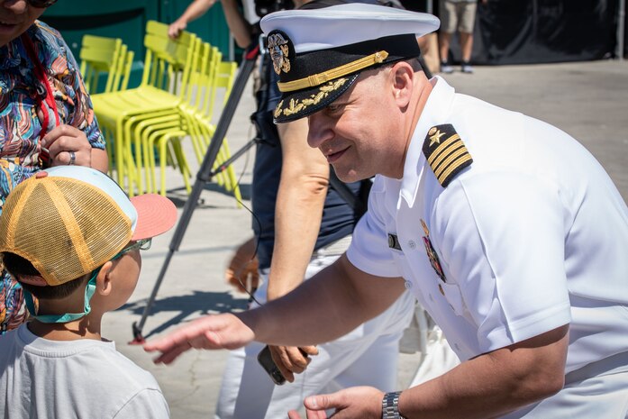 SEATTLE (July 29, 2025) – Capt. Jason Sherman, commander, Navy Region Northwest, speaks with a visitor during Seattle Fleet Week 2025. Seattle Fleet Week is a time-honored celebration of the sea services and provides an opportunity for the citizens of Washington to meet Sailors, Marines and Coast Guardsmen, as well as witness firsthand the latest capabilities of today’s maritime services. (U.S. Navy photo by Mass Communication Specialist 1st Class Shane Bryan/Released)