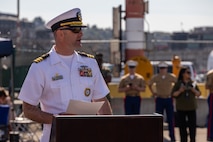 U.S. Navy Cmdr. Rick Jarchow, commanding officer of Navy Talent Acquisition Group Pacific Northwest, speaks to Navy and Marine Corps poolees during an enlistment ceremony during Seattle Fleet Week in Seattle, July 30, 2025. Seattle Fleet Week is a time-honored celebration of the sea services and provides an opportunity for the citizens of Washington to meet Sailors, Marines and Coast Guardsmen, as well as witness firsthand the latest capabilities of today's maritime services. (U.S. Marine Corps photo by Sgt. Bruin Largent)