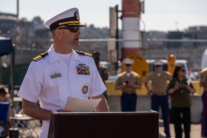 U.S. Navy Cmdr. Rick Jarchow, commanding officer of Navy Talent Acquisition Group Pacific Northwest, speaks to Navy and Marine Corps poolees during an enlistment ceremony during Seattle Fleet Week in Seattle, July 30, 2025. Seattle Fleet Week is a time-honored celebration of the sea services and provides an opportunity for the citizens of Washington to meet Sailors, Marines and Coast Guardsmen, as well as witness firsthand the latest capabilities of today's maritime services. (U.S. Marine Corps photo by Sgt. Bruin Largent)