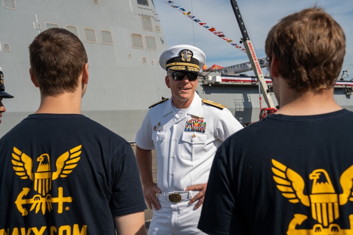 U.S. Navy Rear Adm Donald Wilson Marks, Commander of Carrier Strike Group Nine, Speaks with future Navy Sailors during an enlistment ceremony during Seattle Fleet Week , July 30, 2025. Seattle Fleet Week is a time-honored celebration of the sea services and provides an opportunity for the citizens of Washington to meet Sailors, Marines and Coast Guardsmen, as well as witness firsthand the latest capabilities of today's maritime services. (U.S. Marine Corps photo by Lance Cpl. Avery Wayland)