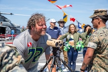 SEATTLE (July 30, 2025) – Seattle Seahawks Legend Joey Hollenbeck tours the San Antonio-class amphibious transport dock ship USS Somerset (LPD 25) during Seattle Fleet Week, June 30, 2025. Seattle Fleet Week is a time-honored celebration of the sea services and provides an opportunity for the citizens of Washington to meet Sailors, Marines and Coast Guardsmen, as well as witness firsthand the latest capabilities of today’s maritime services. (U.S. Navy Photo by Mass Communication Specialist 2nd Class John A. Miller)
