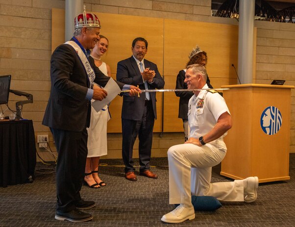 SEATTLE (July 30, 2025) – U.S. Navy Rear Adm. Wilson Marks, commander, Carrier Strike Group 9 (CSG 9), is knighted as Seafair Royalty at City Hall during Seattle Fleet Week, June 30, 2025. Seattle Fleet Week is a time-honored celebration of the sea services and provides an opportunity for the citizens of Washington to meet Sailors, Marines and Coast Guardsmen, as well as witness firsthand the latest capabilities of today’s maritime services. (U.S. Navy Photo by Mass Communication Specialist 2nd Class John A. Miller)