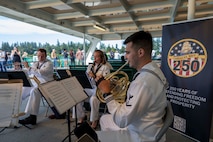 Musician 3rd Class Dean Bradly (left), from Naperville, Ill., plays a flute, Musician 2nd Class Hannah Thorp (middle), from Dallas, plays a clarinet, and Musician 3rd Class Scott Ullman (right), from Moorpark, Calif., plays a French horn while performing on the Seattle ferry during Seattle Fleet Week 2025. Seattle Fleet Week is a time-honored celebration of the sea services and provides an opportunity for the citizens of Washington to meet Sailors, Marines and Coast Guardsmen, as well as witness firsthand the latest capabilities. of today’s maritime services. (U.S. Navy photo by Mass Communication Specialist Seaman Joey Sitter)