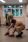 Senior Chief Gas Turbine Systems Technician Francisco Zapata, the top snipe aboard guided missile destroyer USS Jack H. Lucas (DDG 125), sweeps a common space at the Seattle Ronald McDonald House during Seattle Fleet Week, July 31, 2025. Seattle Fleet Week is a time-honored celebration of the sea services and provides an opportunity for the citizens of Washington to meet Sailors, Marines and Coast Guardsmen, as well as witness firsthand the latest capabilities of today’s maritime services. (U.S. Navy photo by Mass Communication Specialist 2nd Class Evan Diaz)
