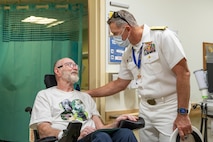 SEATTLE (July 31, 2025) – U.S. Navy Rear Adm. Wilson Marks, Commander, Carrier Strike Group 9 (CCSG 9), talks with a veteran at VA Puget Sound Health Care during Seattle Fleet Week, June 31, 2025. Seattle Fleet Week is a time-honored celebration of the sea services and provides an opportunity for the citizens of Washington to meet Sailors, Marines and Coast Guardsmen, as well as witness firsthand the latest capabilities of today’s maritime services. (U.S. Navy Photo by Mass Communication Specialist 2nd Class John A. Miller)