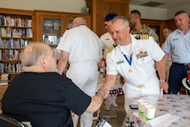 SEATTLE (July 31, 2025) – U.S. Navy Capt. Jason Sherman, Commander, Navy Region Northwest, honors a veteran at VA Puget Sound Health Care during Seattle Fleet Week, June 31, 2025. Seattle Fleet Week is a time-honored celebration of the sea services and provides an opportunity for the citizens of Washington to meet Sailors, Marines and Coast Guardsmen, as well as witness firsthand the latest capabilities of today’s maritime services. (U.S. Navy Photo by Mass Communication Specialist 2nd Class John A. Miller)