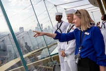 Sailors, assigned to the Arleigh Burke-class guided missile destroyer USS Jack H. Lucas (DDG 125), admire the view of Seattle from the observation deck of the Seattle Space Needle during Seattle Fleet Week 2025. Seattle Fleet Week is a time-honored celebration of the sea services and provides an opportunity for the citizens of Washington to meet Sailors, Marines and Coast Guardsmen, as well as witness firsthand the latest capabilities. of today’s maritime services. (U.S. Navy photo by Mass Communication Specialist Seaman Joey Sitter)