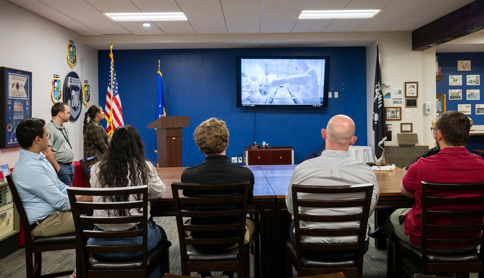 Five students from various colleges and universities across the nation visited the Air Force Technical Applications Center June 26, 2025 as part of the U.S. Air Force’s SMART Scholar Program.  SMART, which stands for science and math research transformation, is a comprehensive career development program that offers personalized mentorship and a network of Defense Department professionals to students who are attending an accredited institution of higher learning within the United States.  Here, the students watched an in-depth mission video about AFTAC’s nuclear treaty monitoring mission in the center’s Heritage Room.   (U.S. Air Force photo by Matthew S. Jurgens)