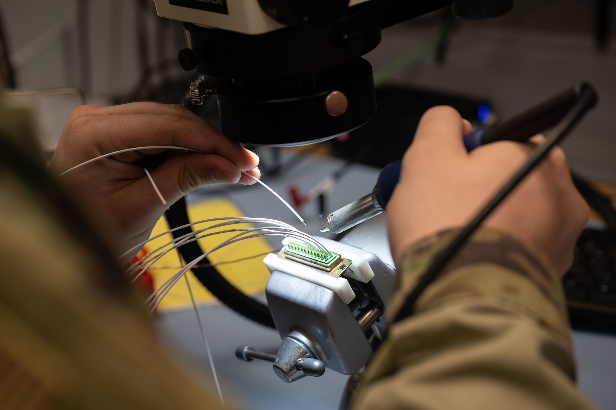 U.S. Air Force Senior Airman Carter Garbe, 436th Maintenance Squadron Air Force Repair Enhancement Program technician, solders a C-5M Super Galaxy control wheel harness at Dover Air Force Base, Delaware, July 16, 2025. AFREP offers cost-effective repairs to unserviceable aircraft parts that are no longer manufactured, keeping aircraft fully operational and mission ready. (U.S. Air Force photo by Airman 1st Class Liberty Matthews)