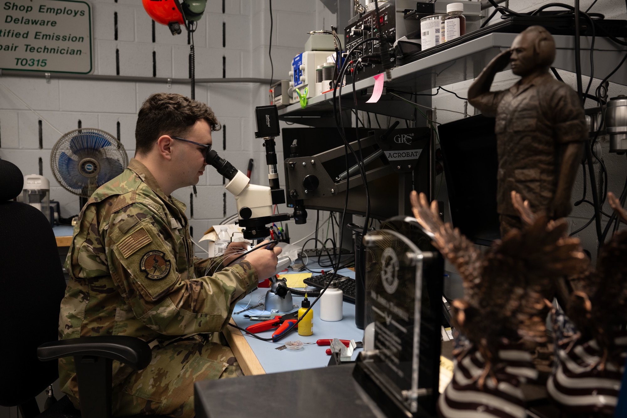 U.S. Air Force Senior Airman Carter Garbe, 436th Maintenance Squadron Air Force Repair Enhancement Program technician, solders a C-5M Super Galaxy control wheel harness at Dover Air Force Base, Delaware, July 16, 2025. The AFREP team takes unserviceable aircraft parts and electronics and repairs them to proper working condition. (U.S. Air Force photo by Airman 1st Class Liberty Matthews)