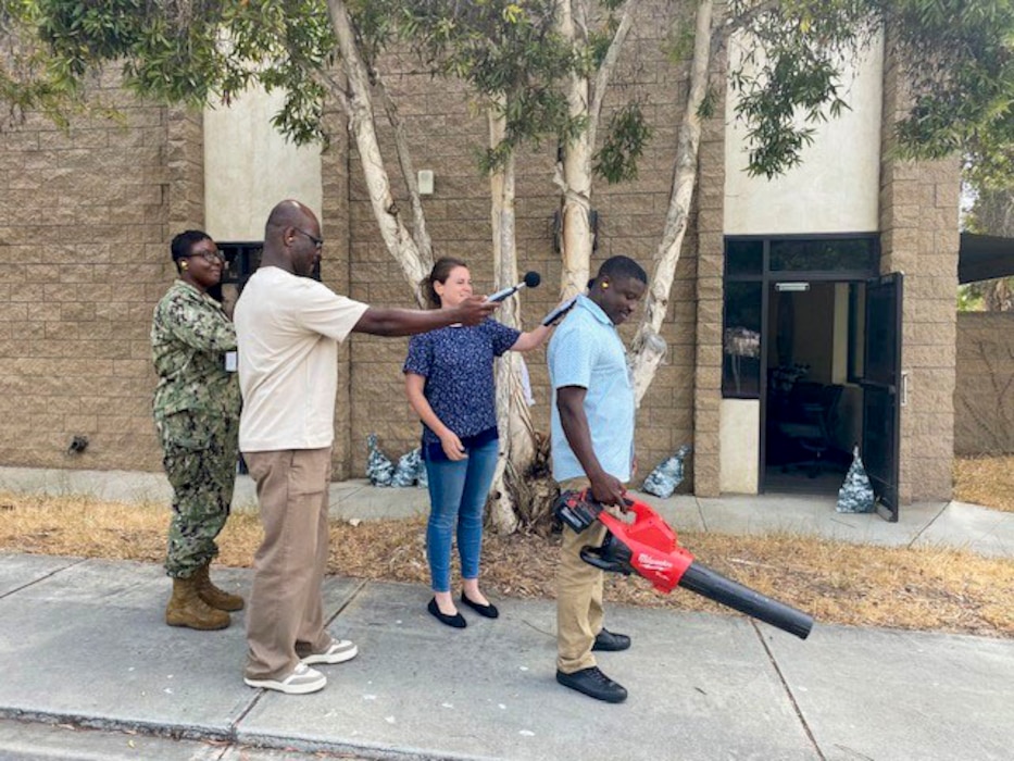 250718-O-NJ594-1200, San Diego, California, July 18, 2025 - Chelsea Siepka, an industrial hygienist with the Navy Marine Corps Force Health Protection Command (NMCFHPC), (third from the left), instructs students during the Industrial Hygiene Techniques/Exposure Monitor Course (EMC) in San Diego, California, July 18, 2025. Students learn how to use a sound level meter while measuring the noise of a leaf blower. The exercise reinforces key techniques for identifying noise hazards in operational environments and collecting reliable sound data for workplace evaluations. The EMC course directly supports Navy Medicine’s commitment to improving the health and operational readiness of warfighters. (U.S. Navy courtesy photo by Revonna Sanders)