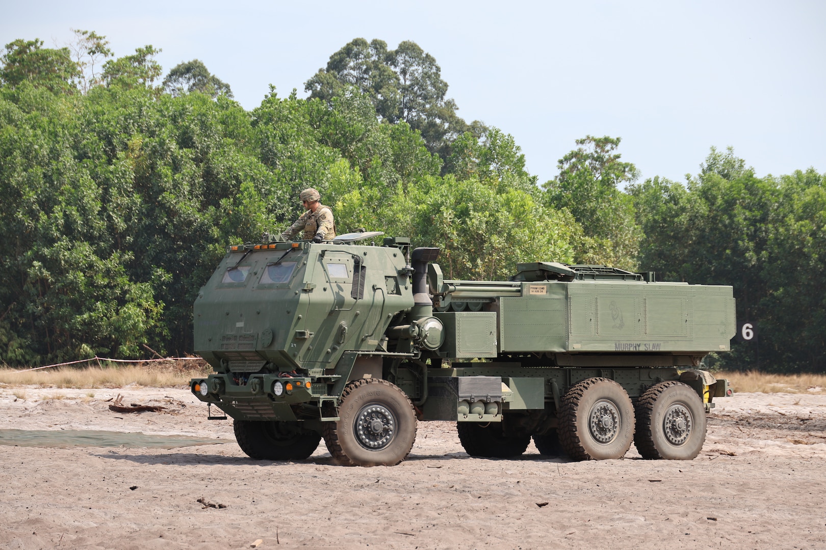 Members of the 1st Battalion, 158th Field Artillery Regiment, 45th Field Artillery Brigade, Oklahoma Army National Guard, operate a High Mobility Artillery Rocket System during Exercise Keris Strike near Lumut, Malaysia, July 30, 2025. (Photo provided by US Embassy Kuala Lumpur)