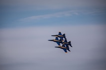The U.S. Navy Flight Demonstration Squadron, the Blue Angels, performs aerobatic formation maneuvers over Lake Washington during Seattle Fleet Week 2025 Aug. 1, 2025.  Seattle Fleet Week is a time-honored celebration of the sea services and provides an opportunity for the citizens of Washington to meet Sailors, Marines and Coast Guardsmen, as well as witness firsthand the latest capabilities of today’s maritime services. (U.S. Navy photo by Mass Communication Specialist 1st Shane Bryan/Released)