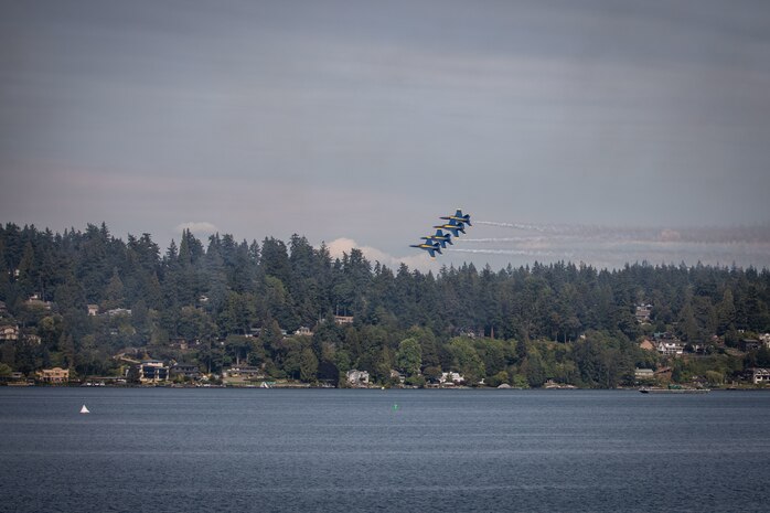 The U.S. Navy Flight Demonstration Squadron, the Blue Angels, performs aerobatic formation maneuvers over Lake Washington during Seattle Fleet Week 2025 Aug. 1, 2025.  Seattle Fleet Week is a time-honored celebration of the sea services and provides an opportunity for the citizens of Washington to meet Sailors, Marines and Coast Guardsmen, as well as witness firsthand the latest capabilities of today’s maritime services. (U.S. Navy photo by Mass Communication Specialist 1st Shane Bryan/Released)