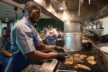 SEATTLE (Aug. 1, 2025) – U.S. Navy Culinary Specialist 2nd Class Arthur Hicks, from Jacksonville, Ark., prepares a fish at Aerlume Seattle during Seattle Fleet Week, Aug. 1, 2025. Seattle Fleet Week is a time-honored celebration of the sea services and provides an opportunity for the citizens of Washington to meet Sailors, Marines and Coast Guardsmen, as well as witness firsthand the latest capabilities of today’s maritime services. (U.S. Navy Photo by Mass Communication Specialist 2nd Class John A. Miller)