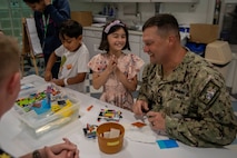 Boatswain’s Mate 1st Class Nathan Burnau, from Barstow, Calif., assigned to the Arleigh Burke-class guided missile destroyer USS Jack H. Lucas (DDG 125), does arts and crafts with patients at the Seattle Children’s Hospital during Seattle Fleet Week 2025. Seattle Fleet Week is a time-honored celebration of the sea services and provides an opportunity for the citizens of Washington to meet Sailors, Marines and Coast Guardsmen, as well as witness firsthand the latest capabilities. of today’s maritime services. (U.S. Navy photo by Mass Communication Specialist Seaman Joey Sitter)