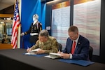 Maj. Gen. Thomas H. Mancino (left), adjutant general for Oklahoma, and Dr. Don Raleigh (right), president of Rogers State University, sign a memorandum of agreement for the Oklahoma Army National Guard’s Guard Officer Leadership Development program at RSU, one of the four programs throughout the state. The GOLD program is designed to develop and prepare individuals for commissioned officer roles in the OKARNG, equipping them with the skills needed to lead Soldiers effectively.



From 1917 to 1971, RSU was known as the Oklahoma Military Academy which has a storied history within Oklahoma as a premiere military academy. The OMA Alumni association is still heavily involved with the university and GOLD program and has scholarship opportunities available to candidates. (Oklahoma National Guard photo by Richard Beam)