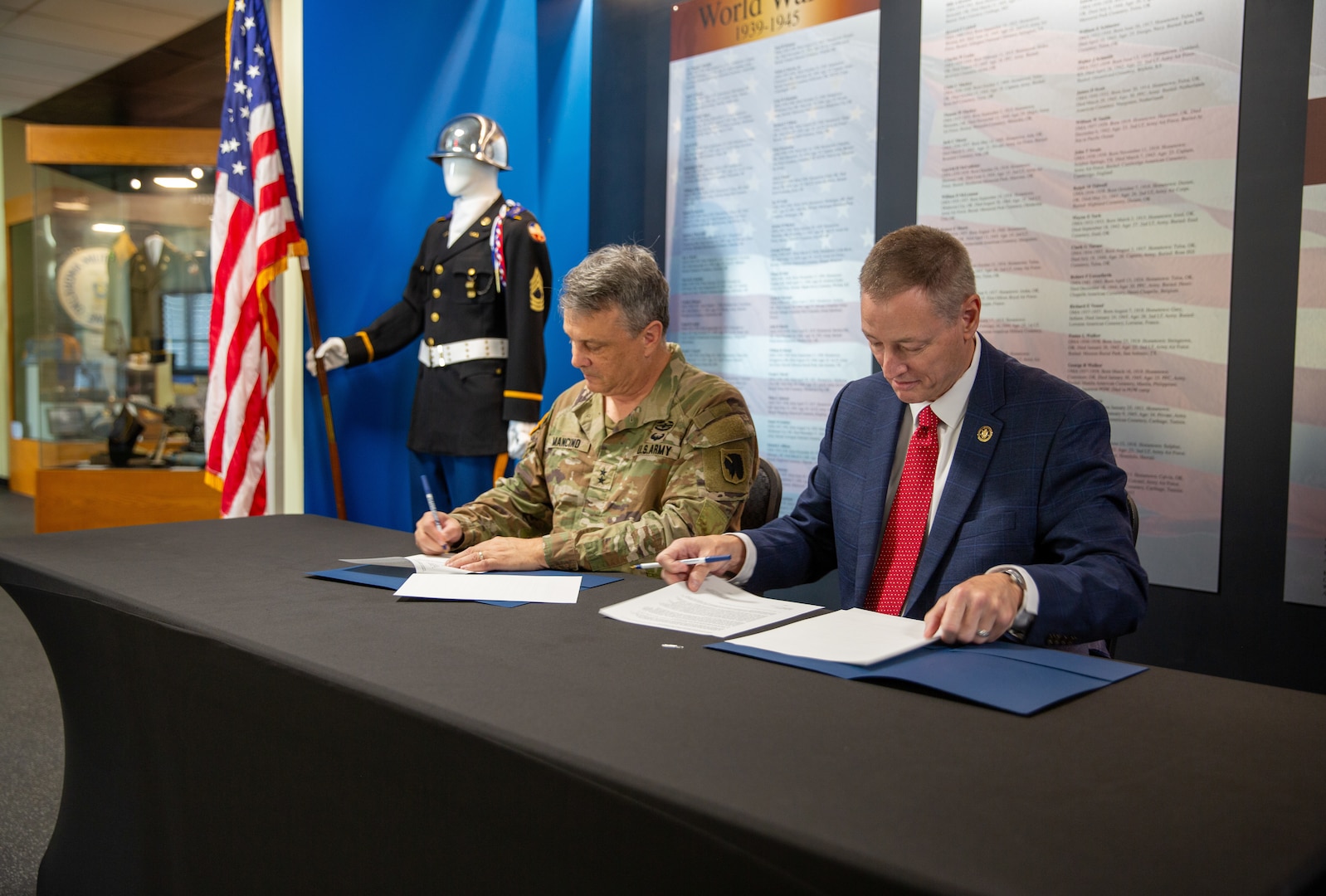 Maj. Gen. Thomas H. Mancino (left), adjutant general for Oklahoma, and Dr. Don Raleigh (right), president of Rogers State University, sign a memorandum of agreement for the Oklahoma Army National Guard’s Guard Officer Leadership Development program at RSU, one of the four programs throughout the state. The GOLD program is designed to develop and prepare individuals for commissioned officer roles in the OKARNG, equipping them with the skills needed to lead Soldiers effectively.

From 1917 to 1971, RSU was known as the Oklahoma Military Academy which has a storied history within Oklahoma as a premiere military academy. The OMA Alumni association is still heavily involved with the university and GOLD program and has scholarship opportunities available to candidates. (Oklahoma National Guard photo by Richard Beam)