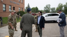Base leadership greets the Congressional Staff Delegation (STAFFDEL) as they arrive at Minot Air Force Base, North Dakota, Aug. 5, 2025. A STAFFDEL is a group of staff members from a committee or personal office of a member of Congress.