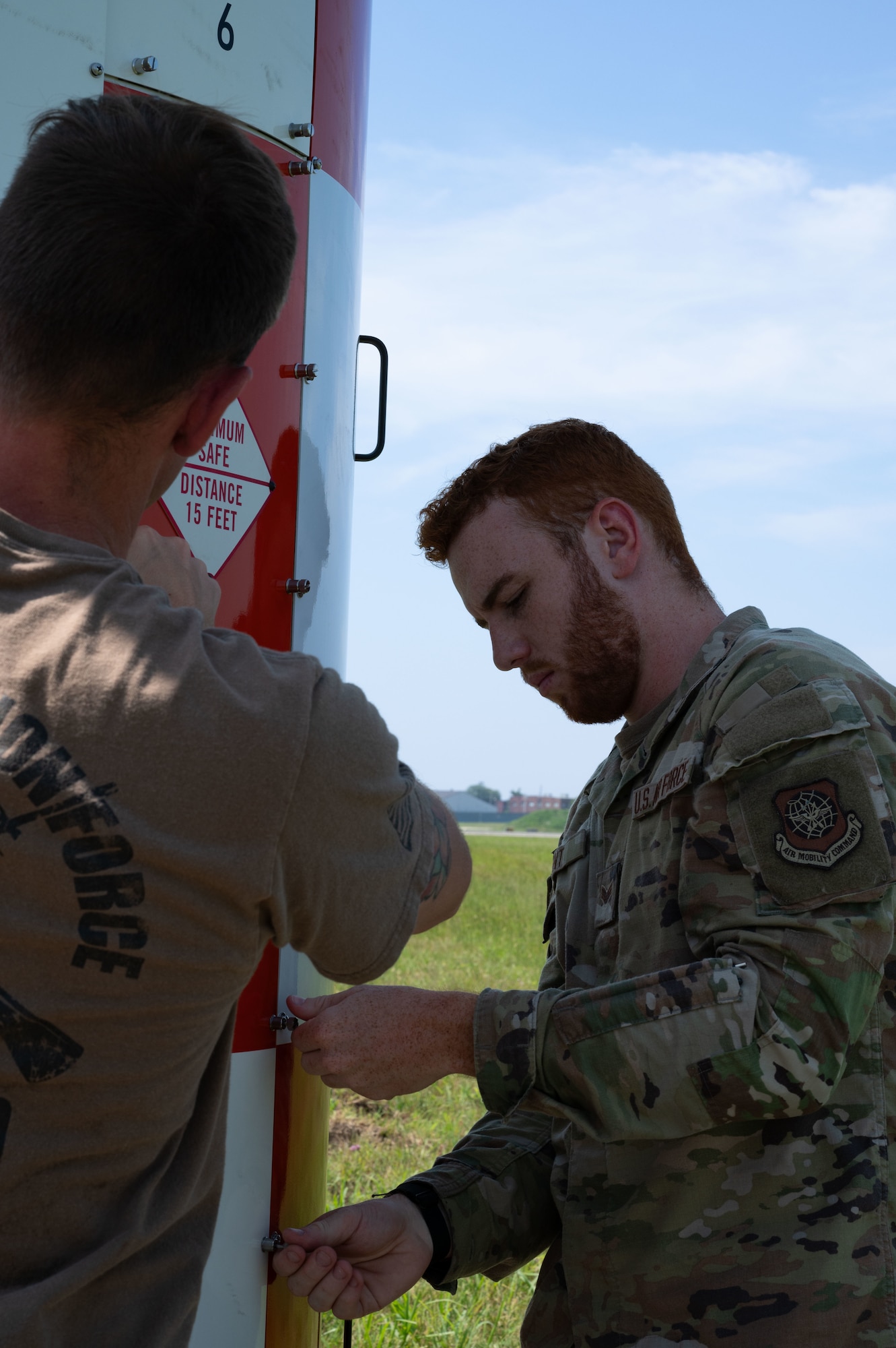 U.S. Air Force Senior Airman Elijah Kent, 305th Operations Support Squadron Radar, Airfield and Weather System technician, screws a panel back onto the AN/FPN-68 Precision Approach Radar system after being briefed on what the technological capabilities of the PAR are at Joint Base McGuire-Dix-Lakehurst, N.J., July 29, 2025.
Part of a RAWS technician’s job is to maintain and fix the PAR system so that U.S. Marine’s assigned to Marine Aircraft Group 49 can land their aircraft safely. (U.S. Air Force photo by Airman Haeleigh Bayle)