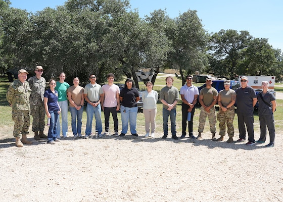 JOINT BASE SAN ANTONIO-FORT SAM HOUSTON – (July 23, 2025) – Student interns assigned to Naval Medical Research Unit (NAMRU) San Antonio enrolled in the Office of Naval Research’s Naval Research Enterprise Internship Program (NREIP) and Oak Ridge Institute for Science and Education (ORISE) observed Air Force Expeditionary Medical Service (EMEDS) training at Camp Bullis. Additionally, the interns had the opportunity to eat Meals, Ready-to-Eat for lunch during their trip to the camp. Navy Medicine Research & Development (NMR&D) makes use of multiple channels to recruit and retain critical U.S. Navy medical support personnel. The research commands reach out to the next generation of scientists through conferences, STEM events, internships and career days, and support recruiting efforts early in undergraduate and graduate programs. NAMRU San Antonio, part of NMR&D, conducts gap-driven combat casualty care, craniofacial, and directed energy research in support of Navy, Marine Corps and joint U.S. warfighter health readiness and lethality while engaged in routine and expeditionary operations. (U.S. Navy photo by Burrell Parmer, NAMRU San Antonio Public Affairs/Released)
