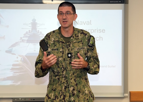 JOINT BASE SAN ANTONIO-FORT SAM HOUSTON – (July 31, 2025) – Cmdr. Nicholas Hamlin, Dental Corps, executive officer, Naval Medical Research Unit (NAMRU) San Antonio, delivers remarks during the annual Naval Research Enterprise Research Intern Program Presentations held at the Battlefield Health and Trauma Research Institute. Eight student interns enrolled in the Office of Naval Research’s Naval Research Enterprise Internship Program (NREIP) and Oak Ridge Institute for Science and Education (ORISE) presented their research to mentors, scientists and staff. NREIP places college and university students in the Department of the Navy laboratories where they take part in real Naval research for ten weeks during the summer. NREIP gives academically talented college students, graduating seniors, and graduate students pursuing STEM careers the opportunity to learn about Naval research and technology while receiving first-class mentoring by top scientists and engineers. ORISE is a U.S. Department of Energy asset that is dedicated to enabling critical scientific, research, and health initiatives of the department and its laboratory system by providing world class expertise in STEM workforce development, scientific and technical reviews, and the evaluation of radiation exposure and environmental contamination. Navy Medicine Research & Development (NMR&D) makes use of multiple channels to recruit and retain critical U.S. Navy medical support personnel. The research commands reach out to the next generation of scientists through conferences, STEM events, internships and career days, and support recruiting efforts early in undergraduate and graduate programs. NAMRU San Antonio, part of NMR&D, conducts gap-driven combat casualty care, craniofacial, and directed energy research in support of Navy, Marine Corps and joint U.S. warfighter health readiness and lethality while engaged in routine and expeditionary operations. (U.S. Navy photo by Burrell Parmer, NAMRU San Antonio Publ
