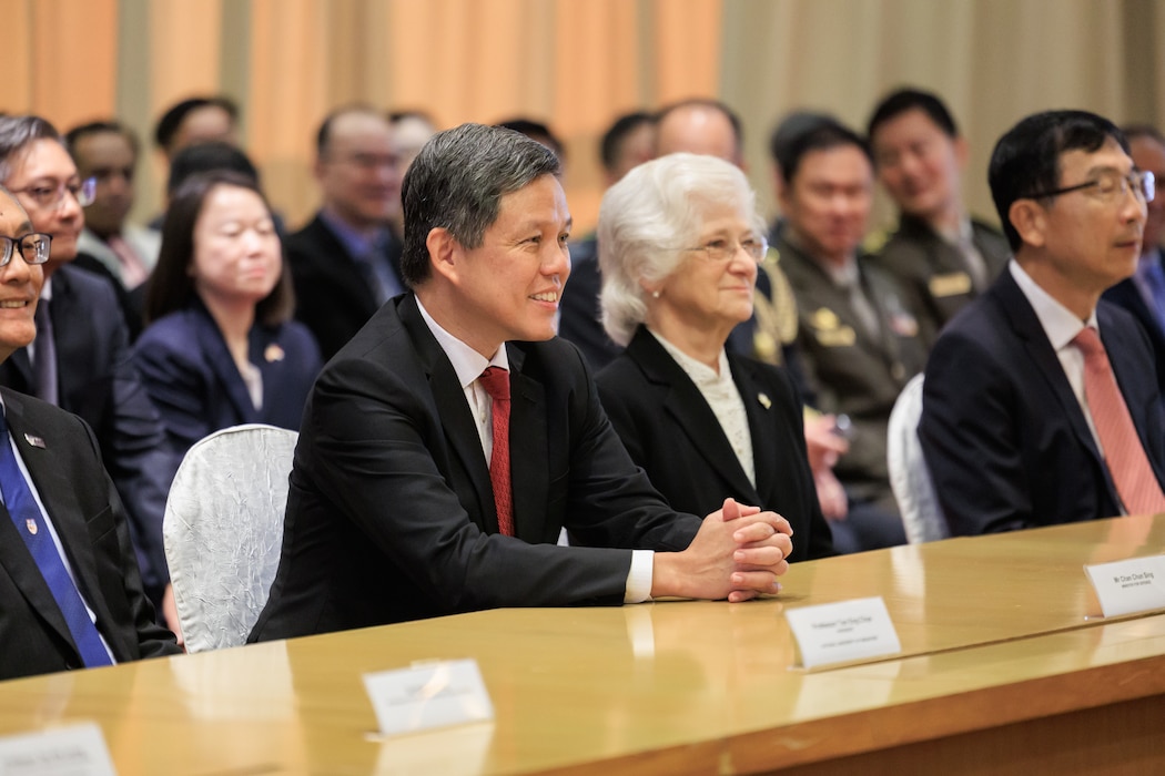 Singapore Minister for Defence Chan Chun Sing, Naval Postgraduate School (NPS) President retired U.S. Navy Vice Adm. Ann E. Rondeau, Ed.D., and National University of Singapore (NUS) Temasek Defence Systems Institute (TSDI) Board Chairman and Chief Defence Scientist Tan Peng Yam listen to remarks at the launch of a new joint degree program, July 23.