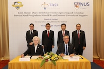 National University of Singapore (NUS) President professor Tan Eng Chye and Naval Postgraduate School (NPS) President retired U.S. Navy Vice Adm. Ann E. Rondeau, Ed.D. signed the new partnership agreement during a ceremony held at NUS in Singapore, July 23.