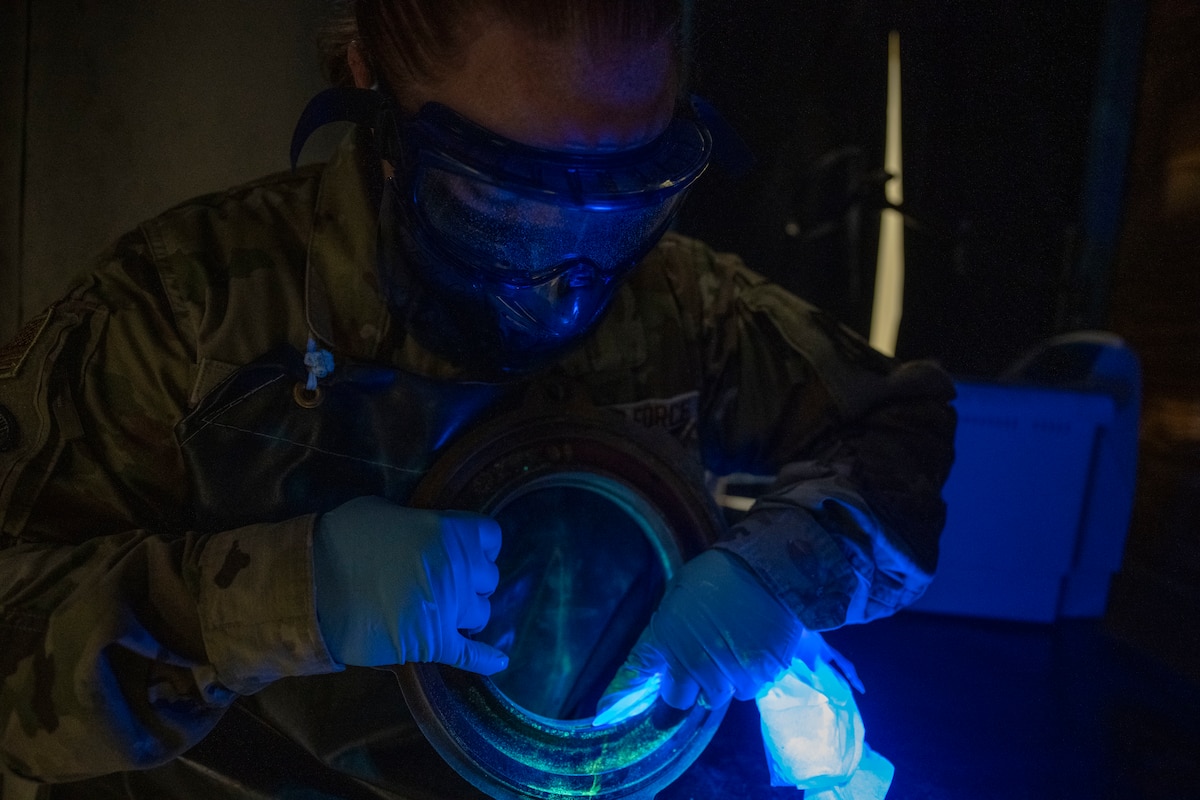 U.S. Air Force Staff Sgt. Estella Gilbert, 35th Maintenance Squadron Nondestructive Inspection (NDI) supervisor, inspects a mechanical component at Misawa Air Base, Japan, Aug. 4, 2025.