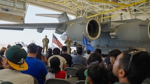 Col. Cade C. Gibson, right, commander of the 349th Maintenance Group, delivers opening remarks for the Travis Air Reserve Experience 2025 at Travis Air Force Base, Calif., Aug. 3, 2025. Chief Master Sgt. Raymond R. Betts, 349th MXG superintendent, left, stands with Gibson as he addresses the attendees. The Travis Air Reserve Experience is a recruiting event designed to give community members an opportunity to interact directly with Reserve Airmen, learn about career paths, and explore the mission of the 349th Air Mobility Wing.