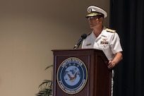 Vice Adm. John Gumbleton, acting commander, U.S. Fleet Forces Command, (USFFC) speaks during relinquishment of command ceremony aboard Naval Station Norfolk on August 6, 2025.