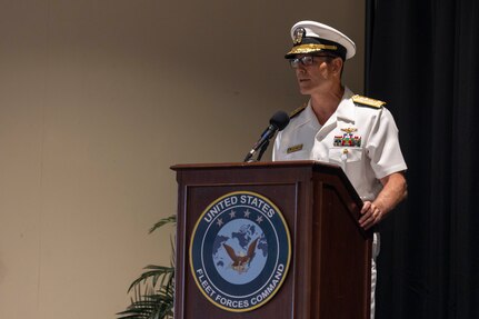 Vice Adm. John Gumbleton, acting commander, U.S. Fleet Forces Command, (USFFC) speaks during relinquishment of command ceremony aboard Naval Station Norfolk on August 6, 2025.