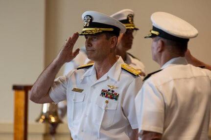 Vice Adm. John Gumbleton, acting commander, U.S. Fleet Forces Command, (USFFC) salutes the side-boys during the relinquishment of command ceremony aboard Naval Station Norfolk on August 6, 2025.