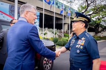 Secretary of the Air Force Troy Meink is greeted by Philippine air force Commanding General Lt. Gen. Arthur Cordura.