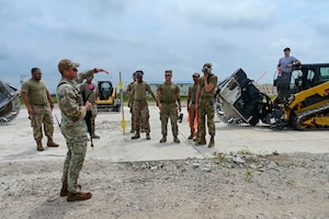 The 8th Civil Engineer Squadron Red Devils attend a safety brief prior to practicing Rapid Airfield Damage Repair (RA/DR) during exercise Beverly Sentinel 25-3 at Kunsan Air Base, Republic of Korea, Aug. 6, 2025. Beverley Sentinel is a combat readiness exercise that tests the Wolf Pack’s ability to survive and operate in a contested environment.