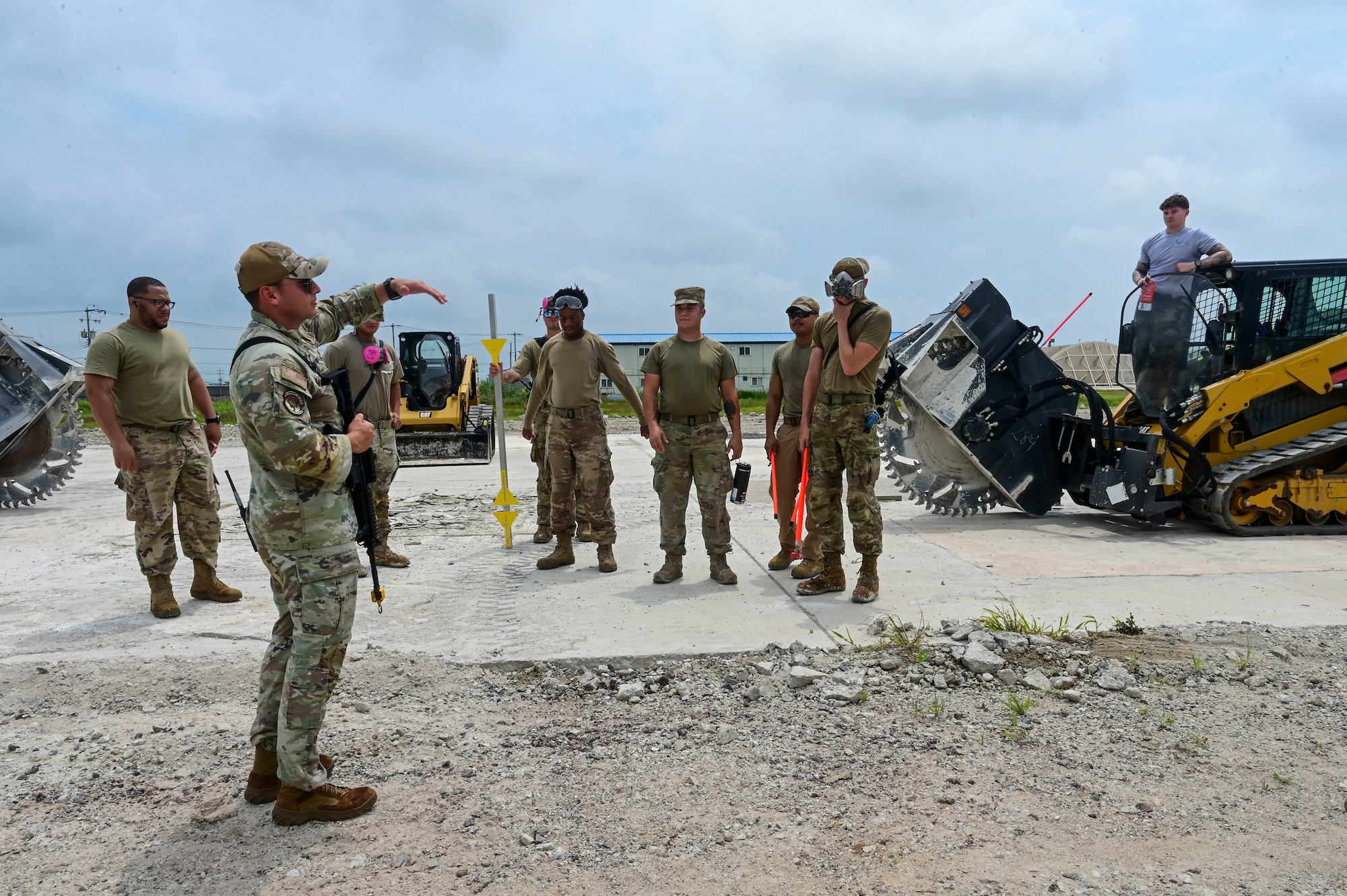 The 8th Civil Engineer Squadron Red Devils attend a safety brief prior to practicing Rapid Airfield Damage Repair (RA/DR) during exercise Beverly Sentinel 25-3 at Kunsan Air Base, Republic of Korea, Aug. 6, 2025. Beverley Sentinel is a combat readiness exercise that tests the Wolf Pack’s ability to survive and operate in a contested environment.