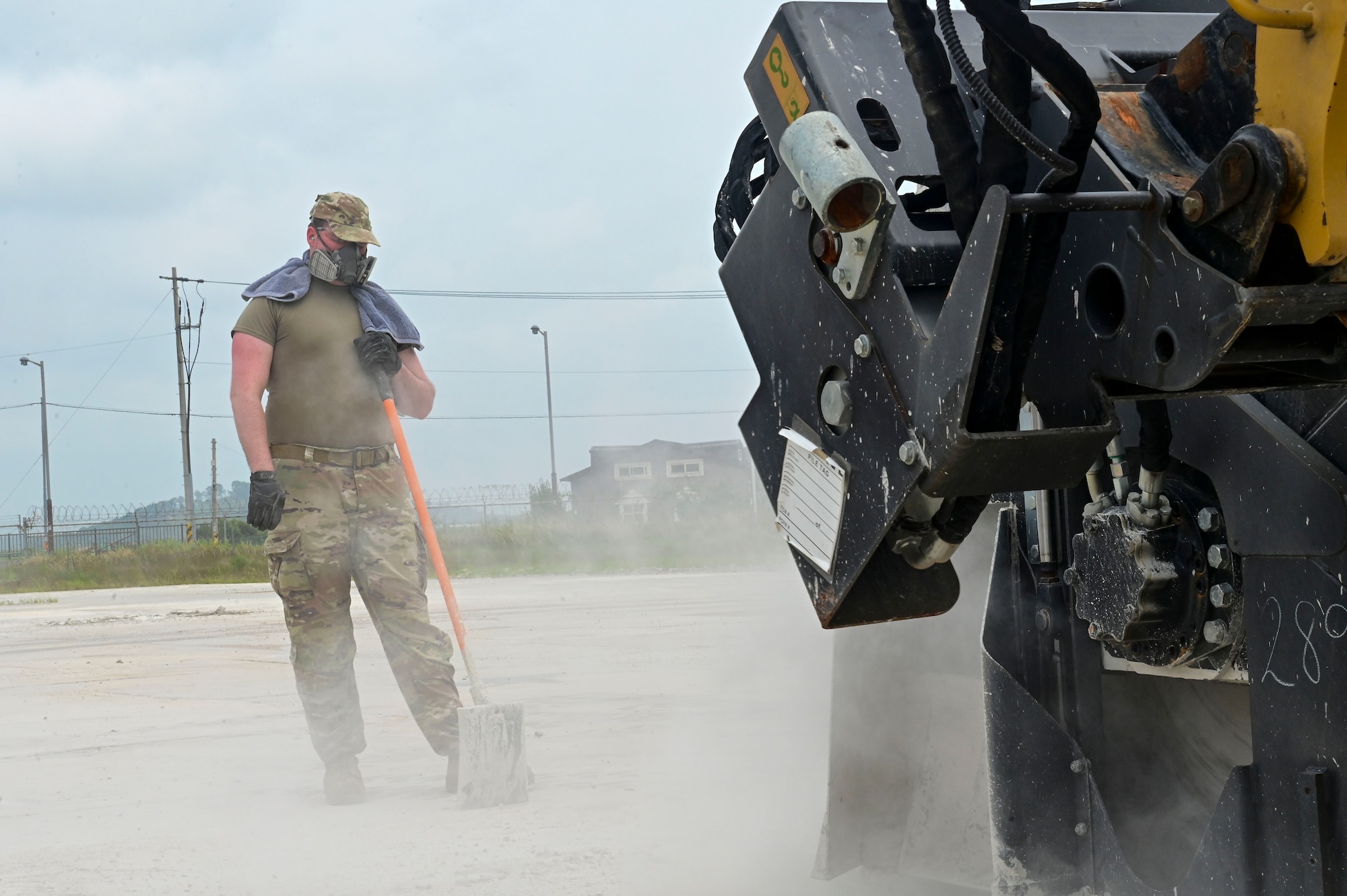 U.S. Air Force Staff Sgt. Ethan Britt, 8th Civil Engineer Squadron pavements and construction equipment Airman, watches a pavement saw cut damaged pavement from the flightline during exercise Beverly Sentinel 25-3 at Kunsan Air Base, Republic of Korea, Aug. 6, 2025. The 8th CES practiced Rapid Airfield Damage Repair (RA/DR) to ensure they maintain the ability to quickly restore damaged airfields after attacks, enabling flight operations to continue.