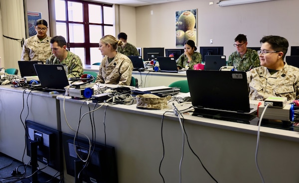 Lt. Christopher Barajas (front-left-center), Audiology Department Head at NMRTC Twentynine Palms, instructs six Sailors who passed the Audiology Technician Course on the final day of training, July 25, 2025. The course equips corpsmen and civilian health technicians with the specialized skills and certification needed to conduct hearing screenings, interpret audiograms, and identify potential issues that could impact a service member’s readiness. With more than 12,000 active-duty personnel enrolled in the installation’s hearing conservation program, audiology plays a vital role in protecting one of the most critical senses required for operational effectiveness—hearing. From early detection of hearing loss to timely medical referrals, properly trained audio technicians help ensure warfighters remain fit for duty. By producing certified professionals who understand both the technical and clinical aspects of hearing health, the course directly supports Navy Medicine’s mission to sustain a medically ready force. (U.S. Navy photo by Christopher Jones, NH/NMRTC Twentynine Palms public affairs officer).