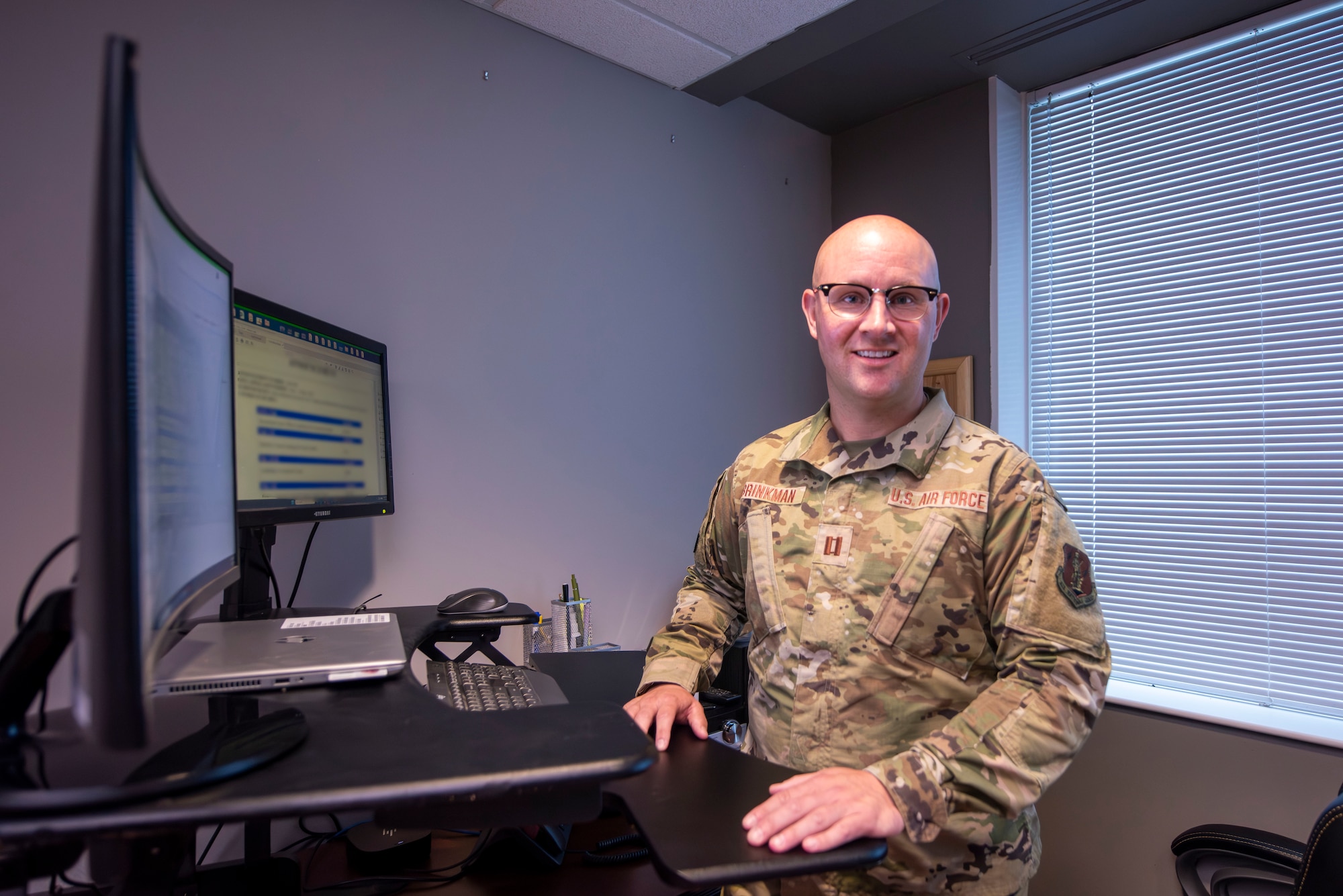 man poses at computer