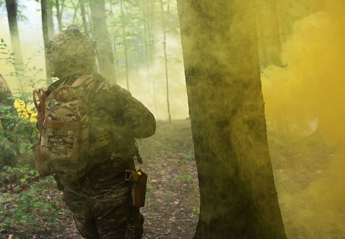 Defender stands in smoke