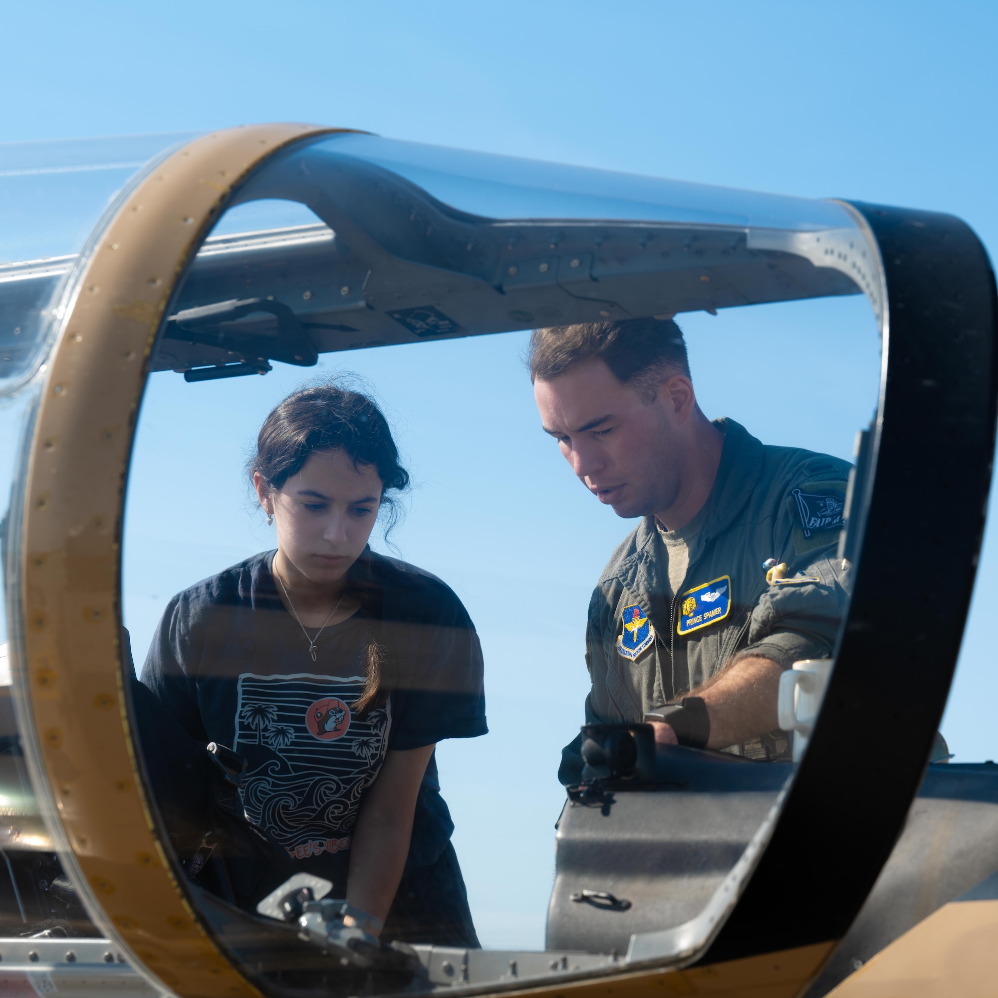 U.S. Air Force 1st Lt. Jacob Spanier, 85th FTS, instructor pilot, shows a participant of Tiger for a Day the cockpit of the T-6 Texan II at Laughlin Air Force Base, Texas, Aug. 5, 2025. Participants were able to see the aircraft that 85th FTS train their pilots in. (U.S. Air Force photo by Airman 1st Class Harrison Sullivan)